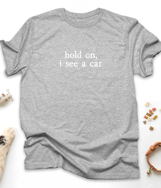 Sport Grey funny cat t-shirt with "Hold On, I See A Cat" design, flat lay top view