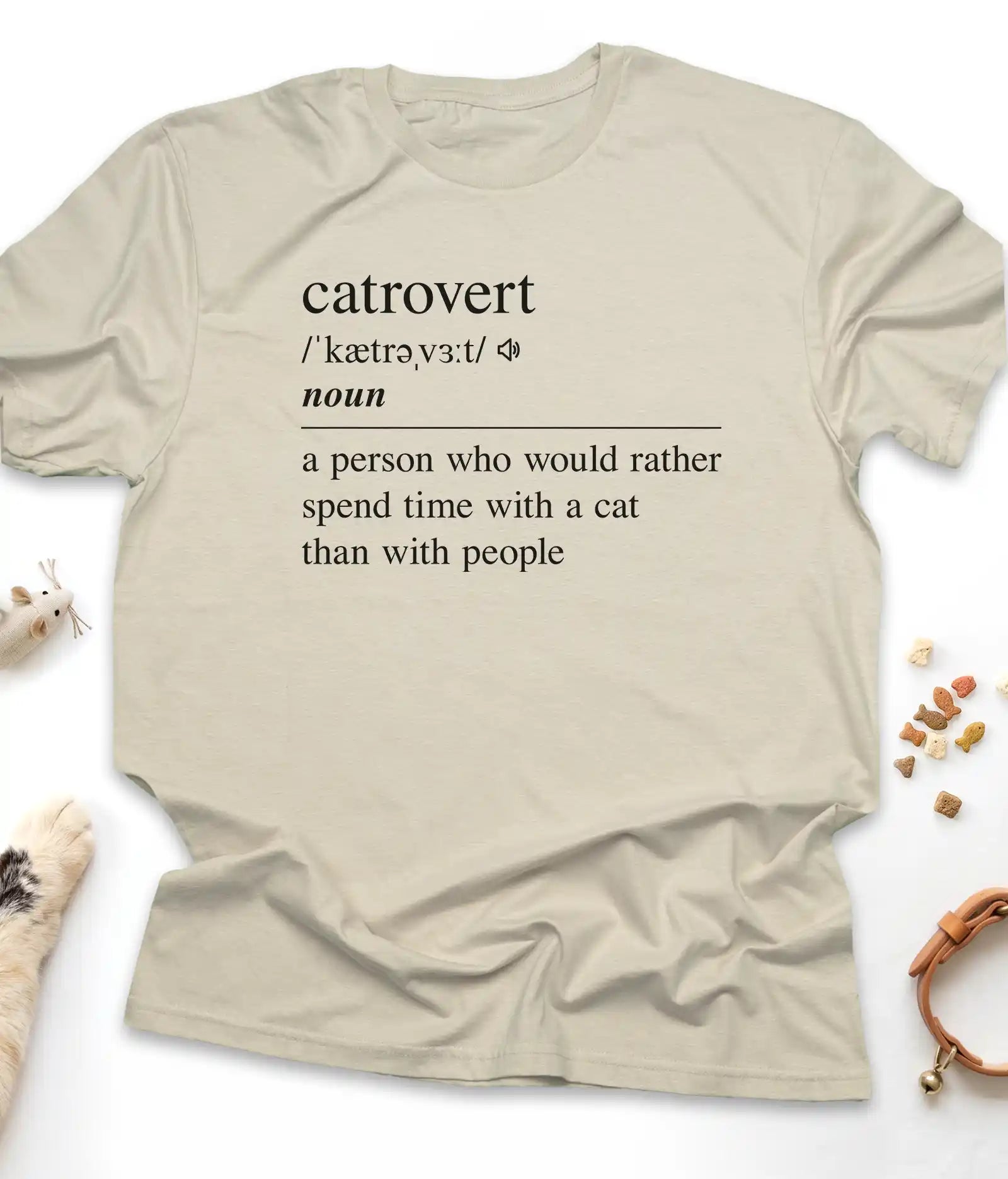 Sand funny cat t-shirt with "Catrovert" dictionary definition design, flat lay top view