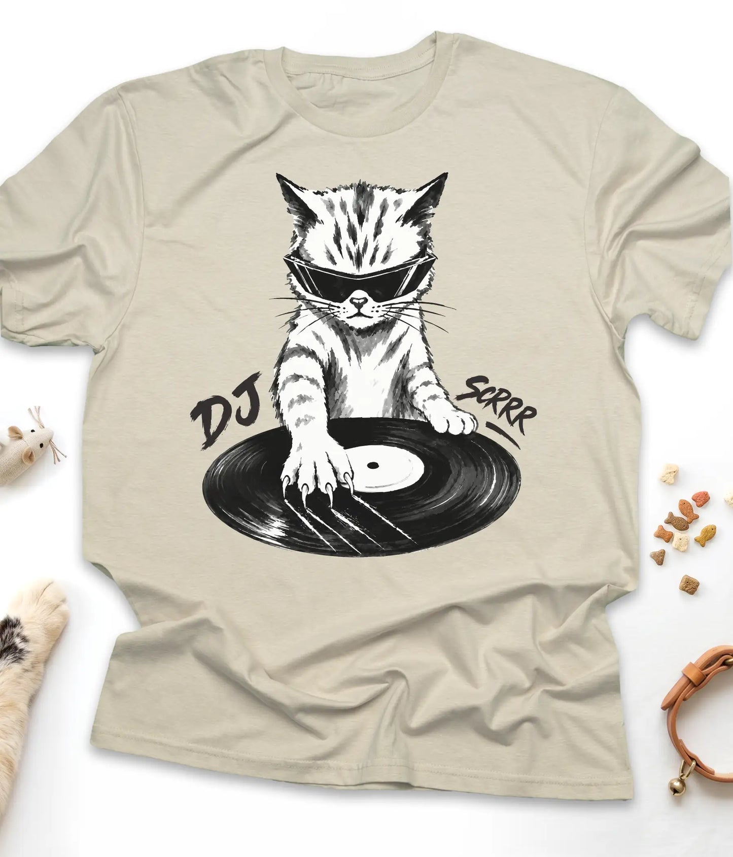 Sand funny cat t-shirt with "DJ Scrrr Cat" design, flat lay top view