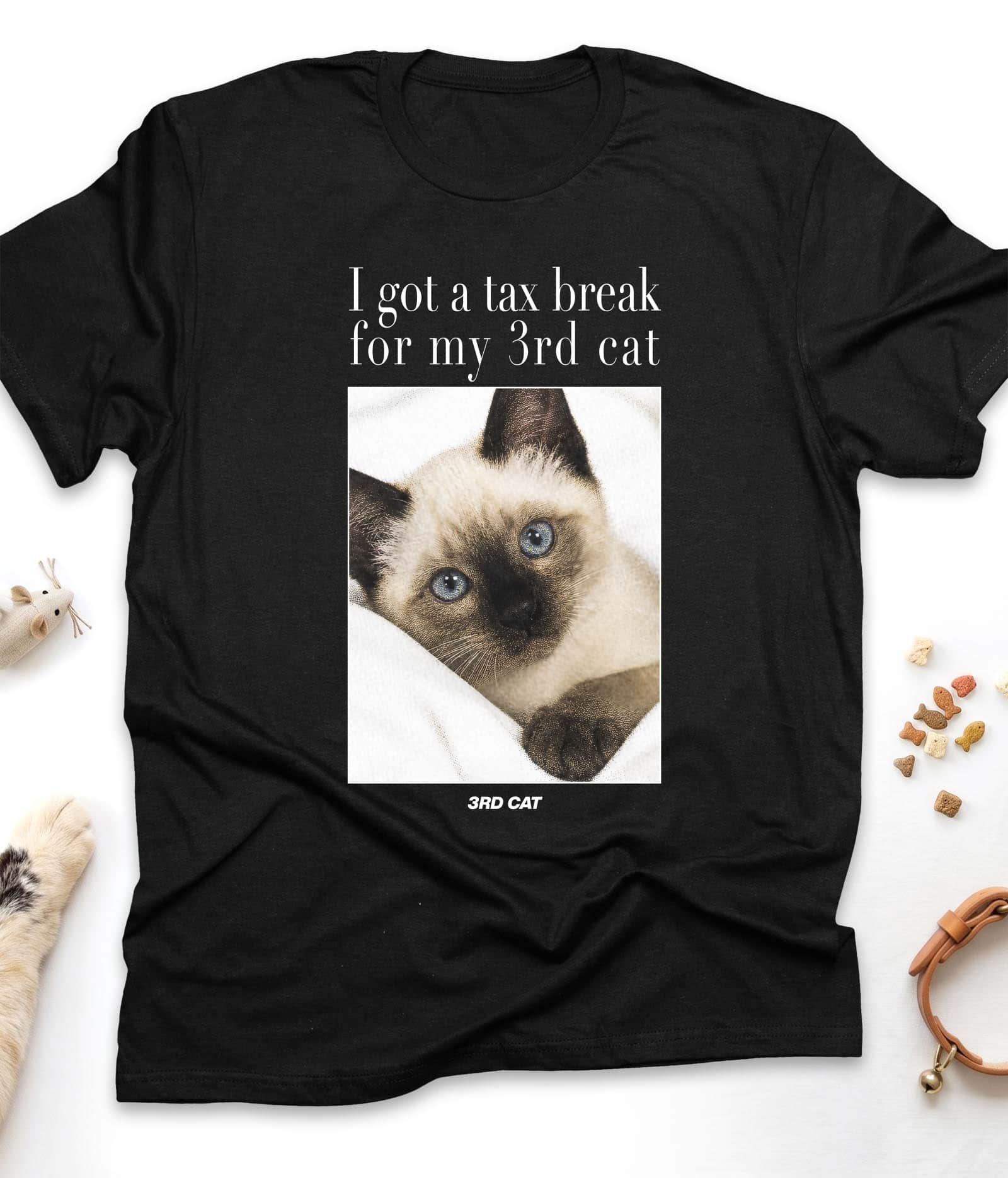 Black funny cat t-shirt with "I Got A Tax Break For My 3rd Cat (Siamese)" design, flat lay top view