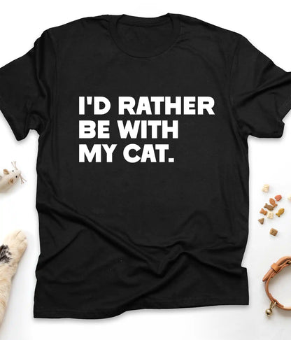 Black funny cat t-shirt with "I'd Rather Be With My Cat" text design, flat lay top view