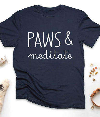 Navy funny cat t-shirt with "Paws & Meditate" design, flat lay top view