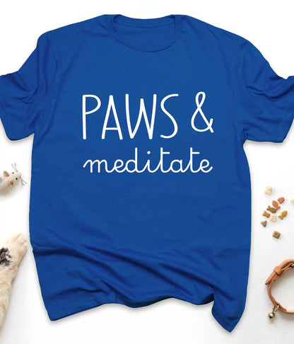 Royal funny cat t-shirt with "Paws & Meditate" design, flat lay top view