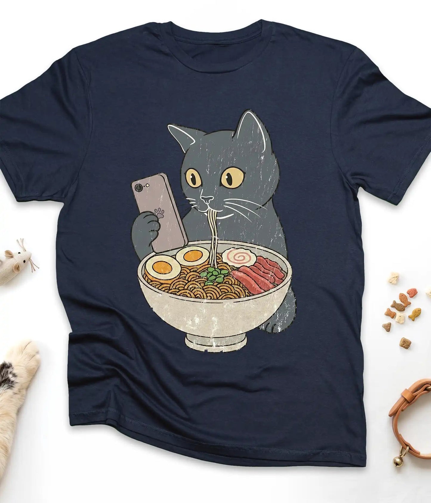 Navy funny cat t-shirt with a cat slurping ramen noodles, flat lay top view