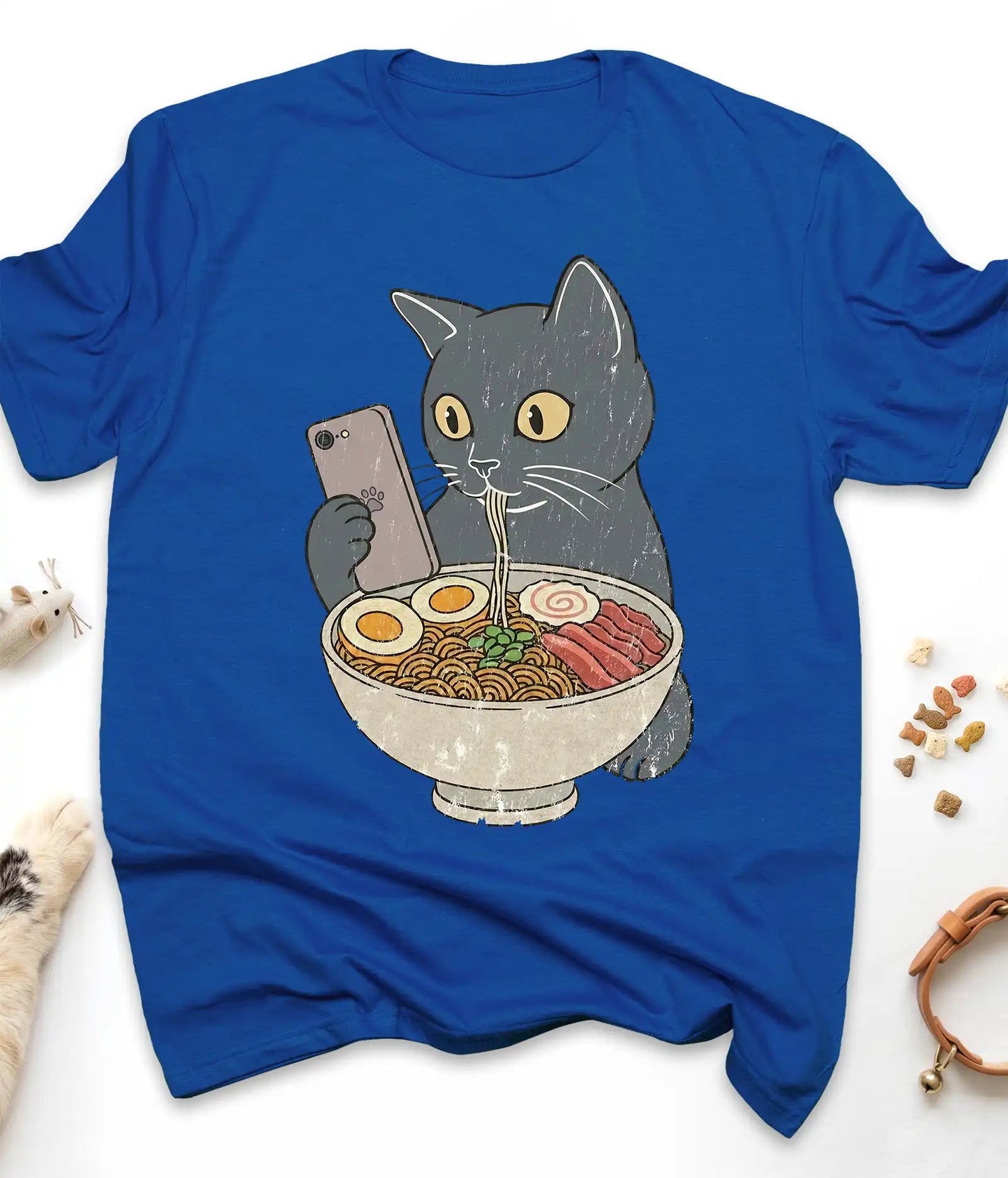 Royal funny cat t-shirt with a cat slurping ramen noodles, flat lay top view