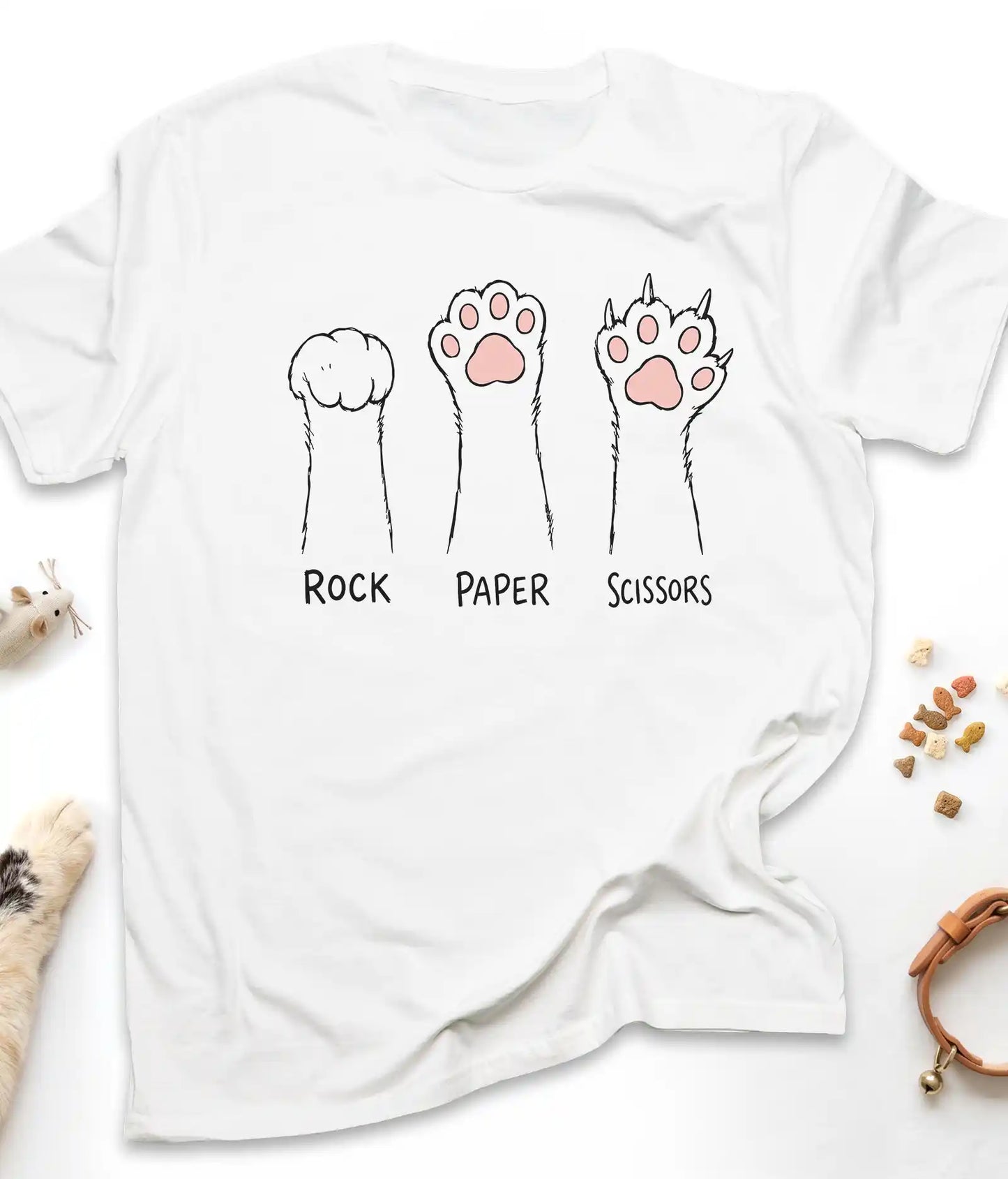 White funny cat t-shirt with cat paws "Rock Paper Scissors" design, flat lay top view