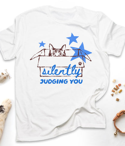 White funny cat t-shirt with "Silently Judging You" design, front view
