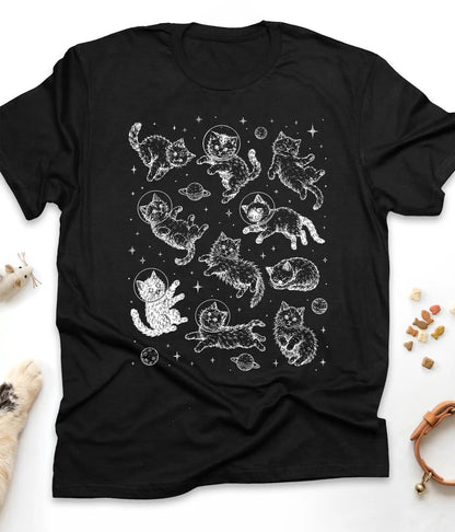 Black funny cat t-shirt with astronaut kittens floating in space, flat lay top view