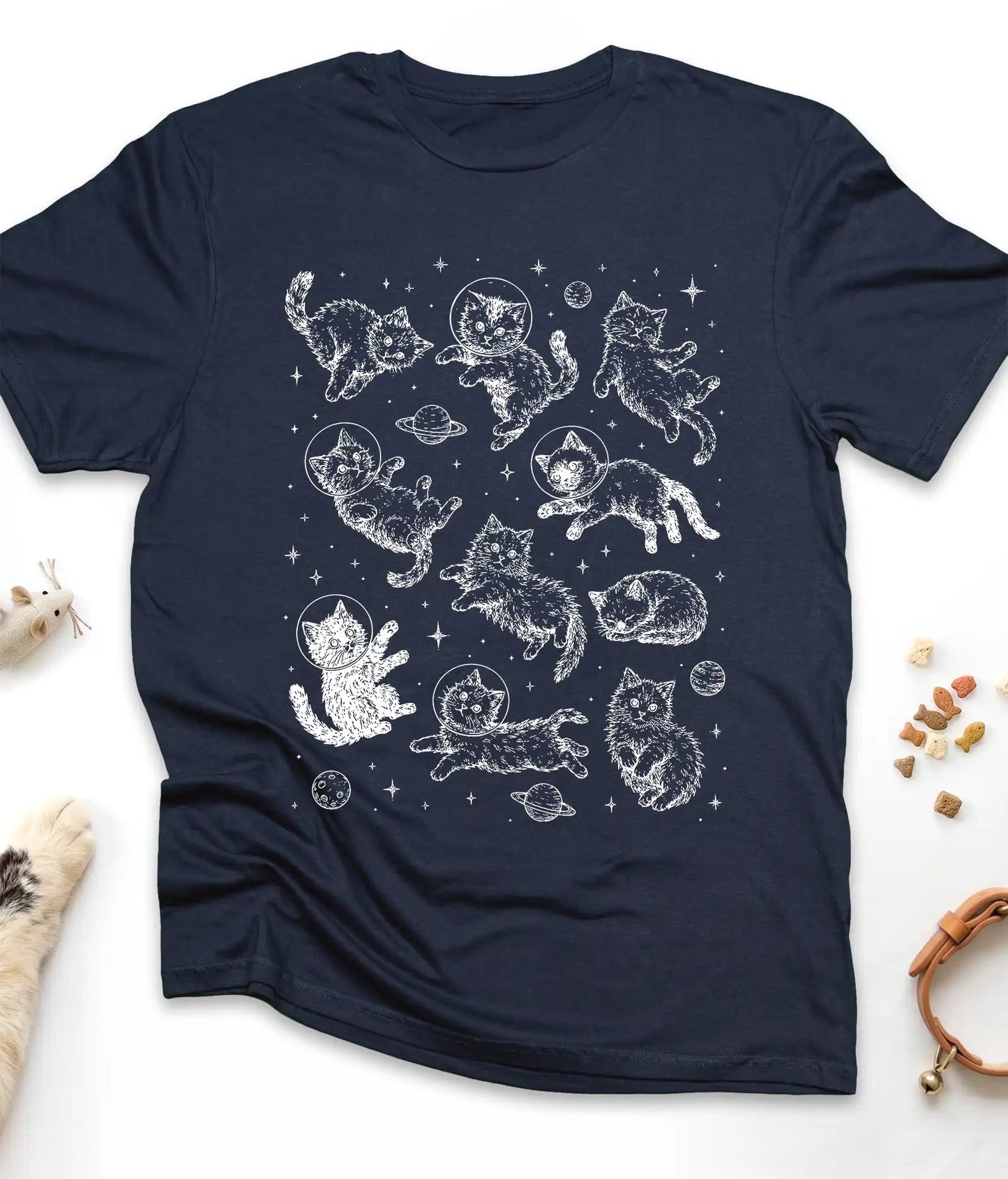 Navy funny cat t-shirt with astronaut kittens floating in space, flat lay top view
