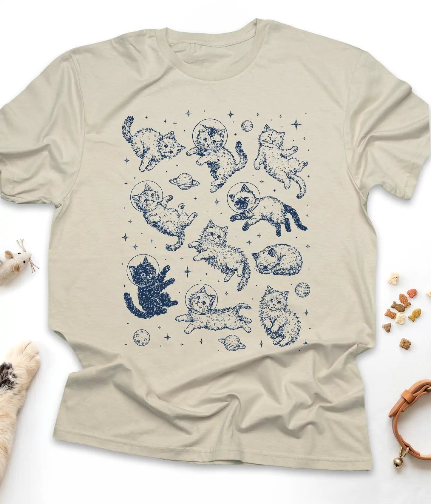 Sand funny cat t-shirt with astronaut kittens floating in space, flat lay top view